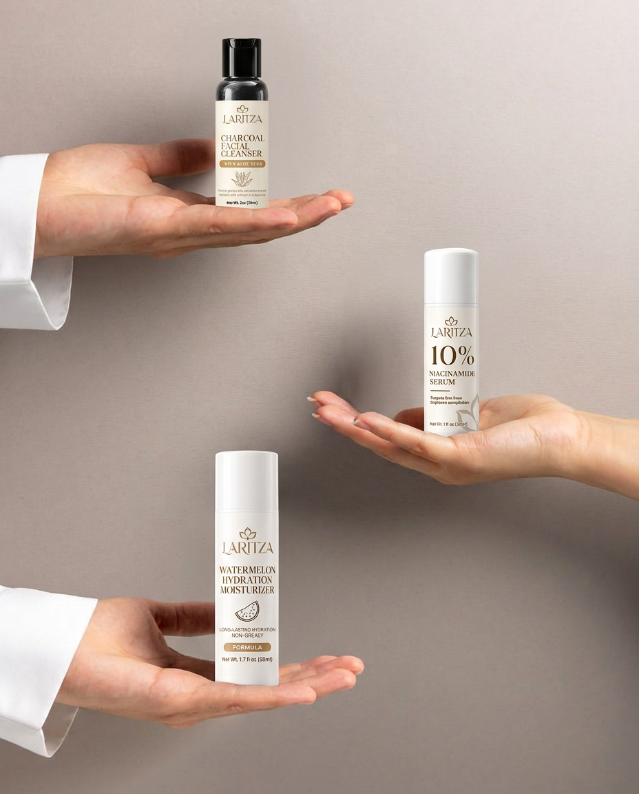 Three hands holding LARITZA Charcoal Facial Cleanser, 10% Niacinamide Serum and Watermelon Hydration Moisturizer with their labels facing forward
